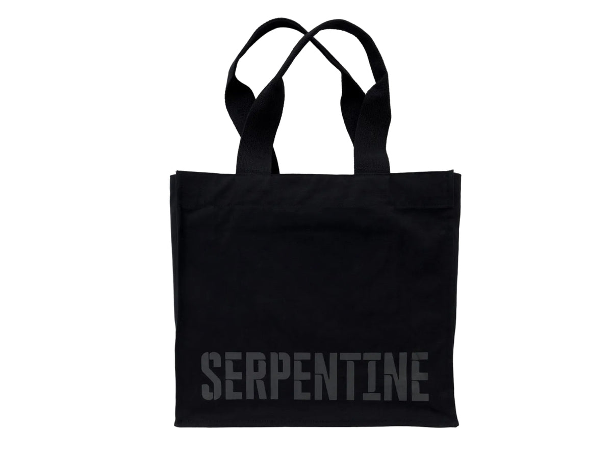 Black tote bag with 'SERPENTINE' branding on a white background